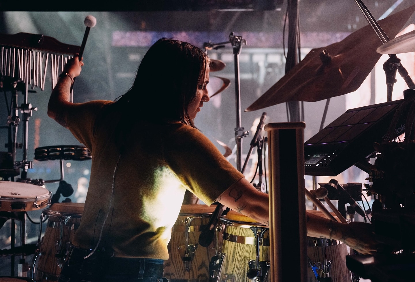 Gabi King Playing LP percussion on stage at Glastonbury with The 1975